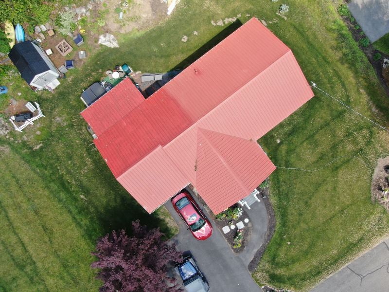 Standing-seam metal roof with concealed fasteners installed on a house
